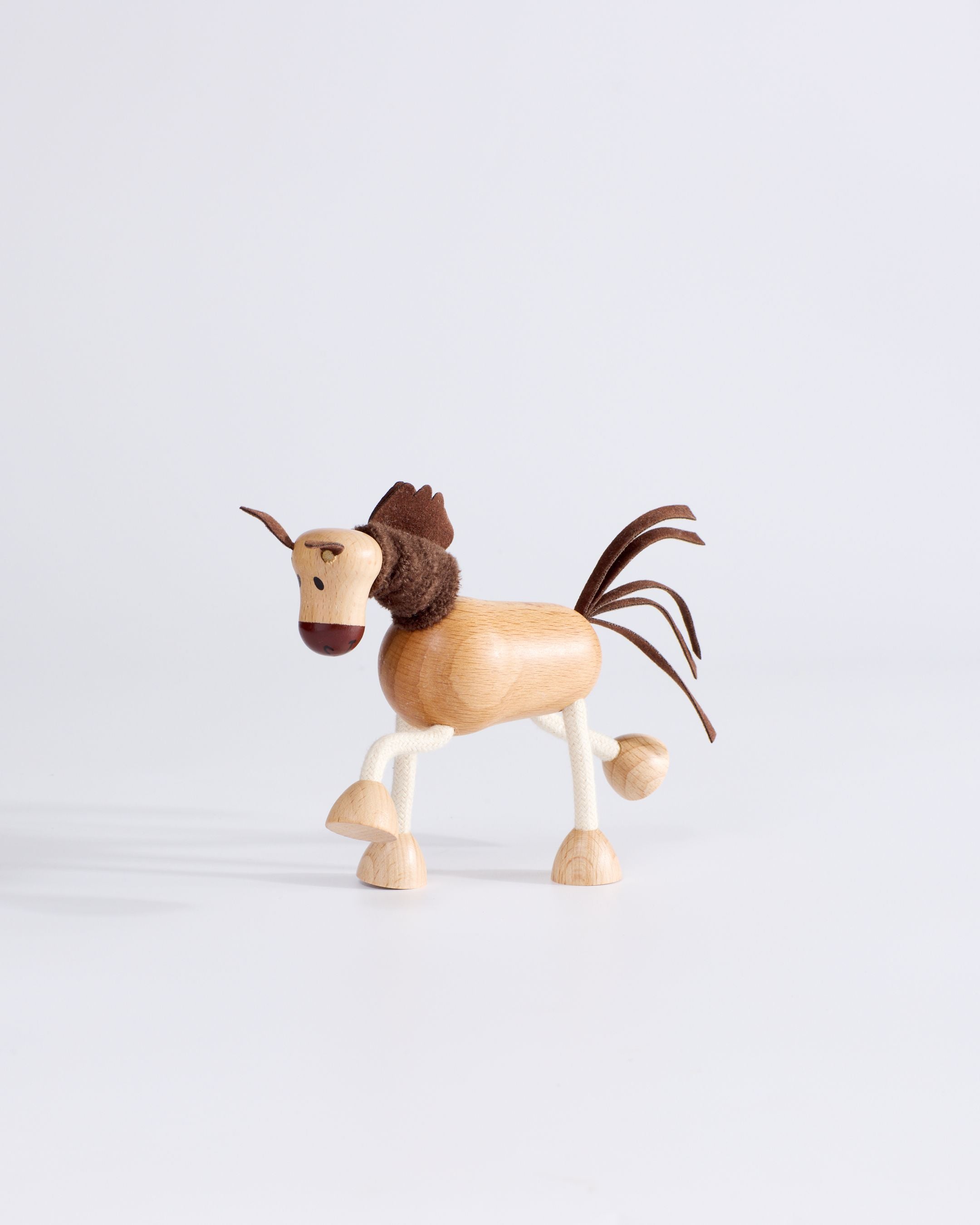 Side profile of Anamalz Wooden Horse â sensory toy with bendable rope legs for toddlers