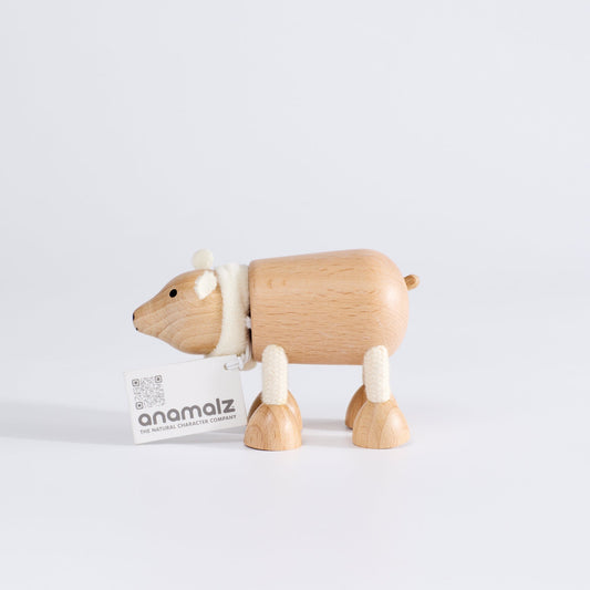 A wooden polar bear toy with a happy facial expression, standing upright on a white background.
