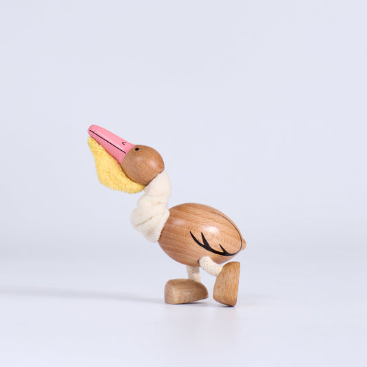 Wooden pelican toy on a white background
