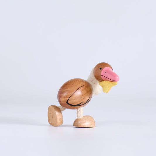 Wooden pelican toy on a white background