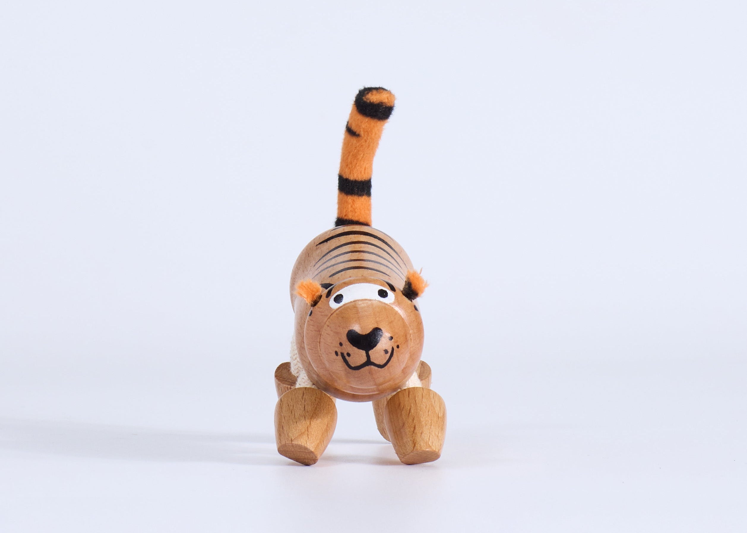 Wooden tiger toy on a white background