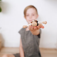 Eco-friendly wooden gorilla toy with flexible arms, perfect for imaginative play and learning.