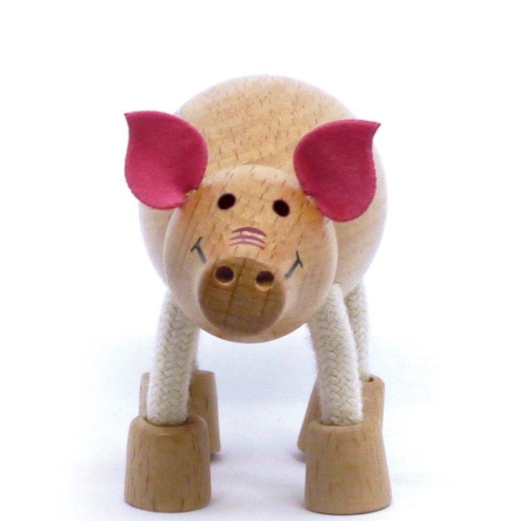 Adorable eco-friendly wooden pig toy with pink fabric ears, perfect for imaginative play and learning.